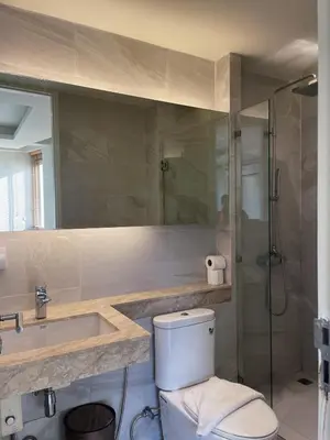 a bathroom with a toilet and a sink and a shower at Prime Location46 sqm Room, King-Size Bed in Ao Nang Beach