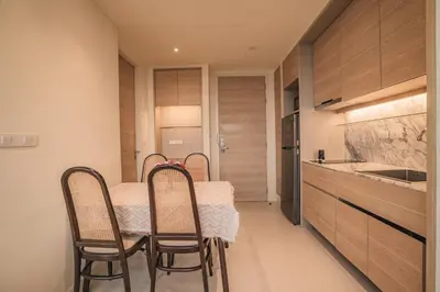 a kitchen with a table and chairs in a room at Luxury sea view apartments in Ao Nang Beach