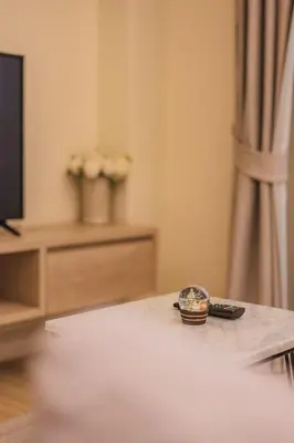 a watch sitting on a table in a living room at Luxury sea view apartments in Ao Nang Beach