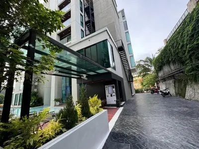 a building with a walkway in front of it at Patong Sea View pool view condo in Patong Beach