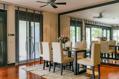 a dining room with a table and chairs at 3BR Casa Blanc - Beachfront Home in Laguna & Layan Chom Tawan and Maan Tawan Residences in Phuket