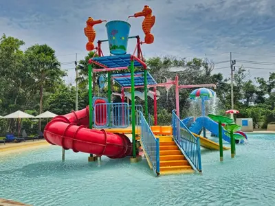 a water park with a water slide in the water at La Vita 5 Stars Great 1 Bdr 3 Pool in Phuket Town