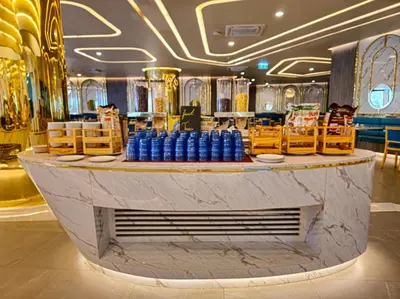 a lobby with a counter with blue bottles on it at La Vita 5 Stars Great 1 Bdr 3 Pool in Phuket Town