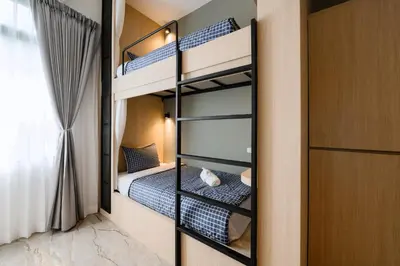 a bedroom with bunk beds in a room at Noppharat Krabi Resort in Ao Nang Beach