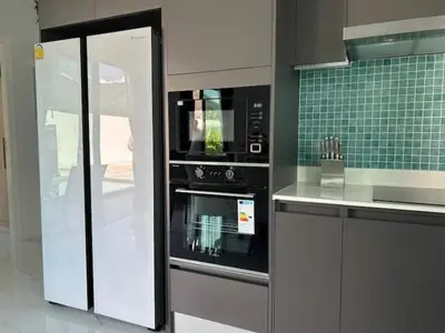 a kitchen with a stainless steel oven and green tile at V150 5-Star Villa Perfect for Relaxation &Comfort in Rawai Beach