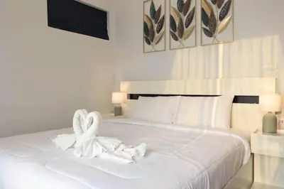 a white bed with two white towels on it at V150 5-Star Villa Perfect for Relaxation &Comfort in Rawai Beach