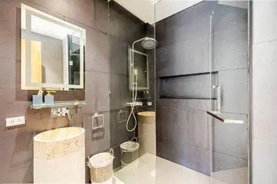 a bathroom with a shower with a sink and a mirror at Lux Pride Villa 3 bedroom Phuket Bang-Tao beach in Ban Phak Chit