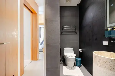 a bathroom with a toilet and a sink at Lux Pride Villa 3 bedroom Phuket Bang-Tao beach in Ban Phak Chit