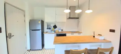 a kitchen with a refrigerator and a table and chairs at JU1 NEW Halo Nayang Руб ВАТСАП669З582I976 in Nai Yang Beach
