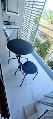 a table and a chair in a room with a window at JU1 NEW Halo Nayang Руб ВАТСАП669З582I976 in Nai Yang Beach
