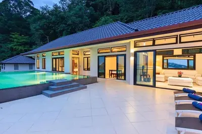 a large backyard with a swimming pool and a house at 10 - Panoramic View on Ao Yon Beach in Ko Thanan