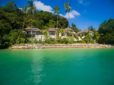 a house on a tropical island in the water at 10 - Panoramic View on Ao Yon Beach in Ko Thanan