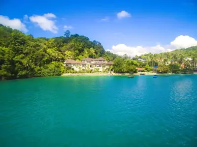 a view of a lake with houses on the shore at 10 - Panoramic View on Ao Yon Beach in Ko Thanan