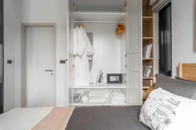 a bedroom with a bed and a closet at Title Halo I love Asia Naiyang Pool Gym in Nai Yang Beach