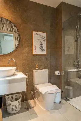a bathroom with a toilet and a sink and a mirror at Title Halo I love Asia Naiyang Pool Gym in Nai Yang Beach