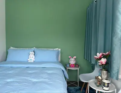 a blue bed with two stuffed animals on top of it at Camping Phuket 88 in Kathu