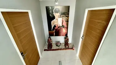 a hallway with two doors and a painting on the wall at Sawansa 33A 400m2 Luxury Seaview Pool near Beach in Patong Beach