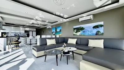 a living room with a couch and a table at Sawansa 33A 400m2 Luxury Seaview Pool near Beach in Patong Beach