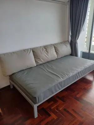a couch sitting in a living room with ainyl at Sawansa 20 3BR 300m2 Modern Seaview house near Beach in Patong Beach