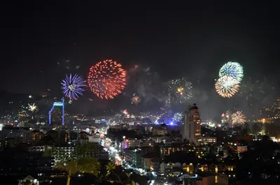 a city with fireworks in the sky at night at Sawansa 20 3BR 300m2 Modern Seaview house near Beach in Patong Beach