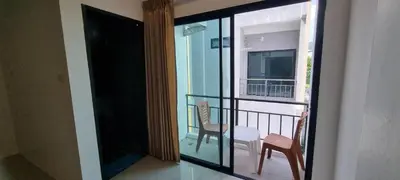 a view of a balcony with a table and chairs at Sawadee622,Naiharn & Rawai beach Phuket in Rawai Beach