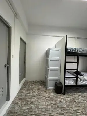 a bedroom with a bunk bed and a closet at Phuket Hostel at Rawai in Phuket Town