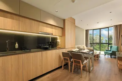 a kitchen and living room with a table and chairs at New 1bdr apartment BangTao Beach C410 in Laguna Phuket