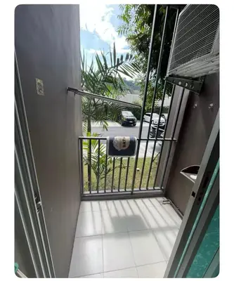 an open door to a balcony with a view of a street at Dcondo kuku resort in Ban Phlu Yai
