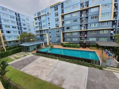 an overhead view of a swimming pool in front of a building at Dcondo Creek Poolview by Lachambre Phuket in Phuket Town