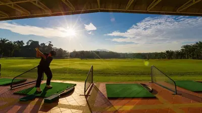 a man is standing on a golf course at Blue Canyon Country Club Golf Course Maikhao in Phuket