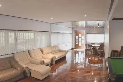 a living room with couches and a table with a pool table at Blue Canyon Country Club Golf Course Maikhao in Phuket