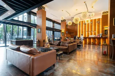 a lobby with leather couches and a bar at Apartment 1 - bedroom Kamala in Kamala Beach