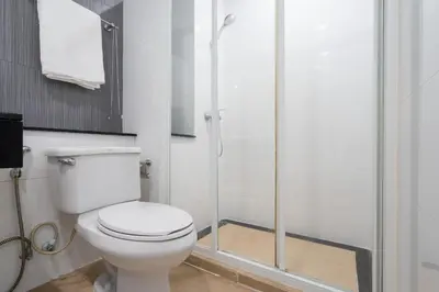 a bathroom with a toilet and a shower at Phuket Villa 1 bedroom apartment in Patong in Patong Beach