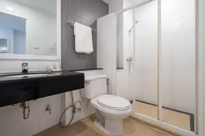 a bathroom with a toilet and a sink and a shower at Phuket Villa 1 bedroom apartment in Patong in Patong Beach