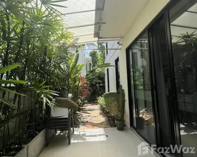 an empty courtyard of a house with plants at 4 bedroom Laguna Pool Villa in Laguna Phuket