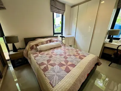 a bedroom with a bed with a quilt on it at 4 bedroom Laguna Pool Villa in Laguna Phuket