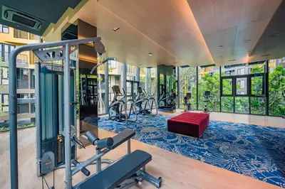a gym with cardio equipment in a building at The Base Central Phuket-C54BS in Phuket Town