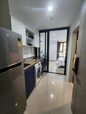 a kitchen with a refrigerator and a dishwasher at The Base Central Phuket-C54BS in Phuket Town