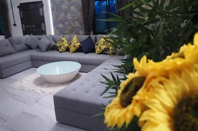 a living room with a couch and a table at Villa Omloft in Changwat Phuket