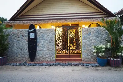 a front door of a house with a sign on it at Villa Omloft in Changwat Phuket
