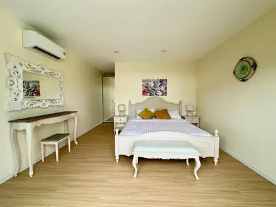 a bedroom with a white bed and a desk at Dolce Vita Villa Memory Bang-Tao Phuket in Ban Thalat Choeng Thale