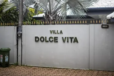a white wall with the words villa police vita at Dolce Vita Villa Memory Bang-Tao Phuket in Ban Thalat Choeng Thale