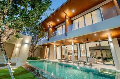 an exterior view of a house with a swimming pool at Liva Villa near Rawai Phuket in Ban Saiyuan (1)