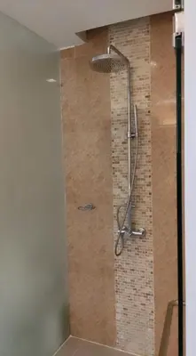 a shower with a shower head in a bathroom at Thebirdhouse Patong Phuket 302 in Patong Beach