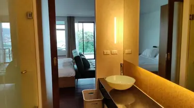 a bathroom with a sink and a mirror at Thebirdhouse Patong Phuket 302 in Patong Beach