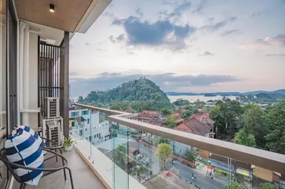 a balcony with a view of a city at The Paradise sea view apartment in Krabi town