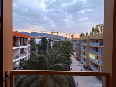 a view of a street from a balcony of a building at Laguna BeachSide 200m to beach BangTao in Bang Tao Beach