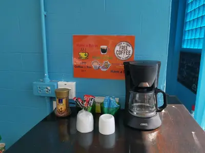 a coffee maker sitting on top of a counter at myPatong Social Hostel in Patong Beach
