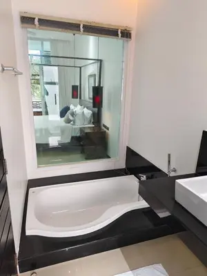 a bathroom with a bath tub and a sink at Oxygen Villa 3 beds in Rawai Beach