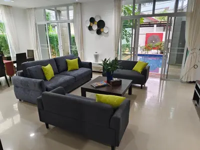 a living room with two couches and a coffee table at Oxygen Villa 3 beds in Rawai Beach